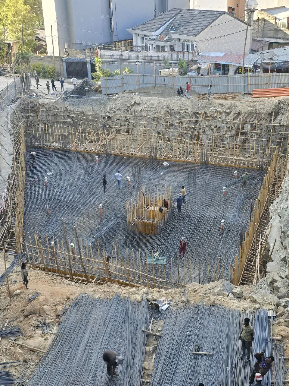 Foundation reinforcement and material staging for high-rise construction